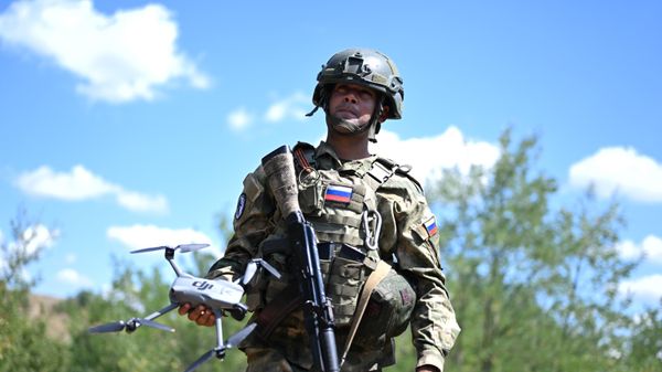 An American with Russian citizenship is fighting as part of Battlegroup Tsentr - Sputnik International