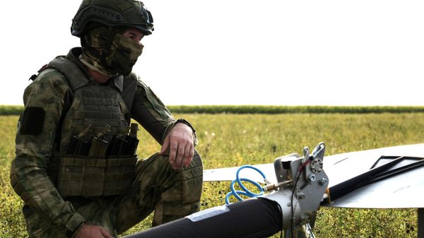 A Russian serviceman of the 116th separate special purpose brigade of the Russian National Guard prepares to launch an unmanned aerial vehicle - Sputnik International