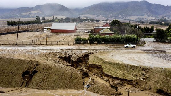 In this aerial image taken with a drone, a truck drives along River Rd. where heavy rains have caused mudslides and flooding near Salinas in Monterey County, Calif., on Thursday, Jan. 28, 2021 - Sputnik International