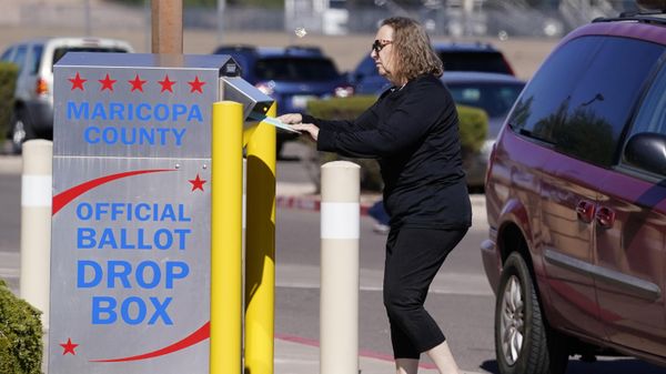 A voter places a ballot in an election voting drop box in Mesa, Ariz., Oct. 28, 2022.  - Sputnik International