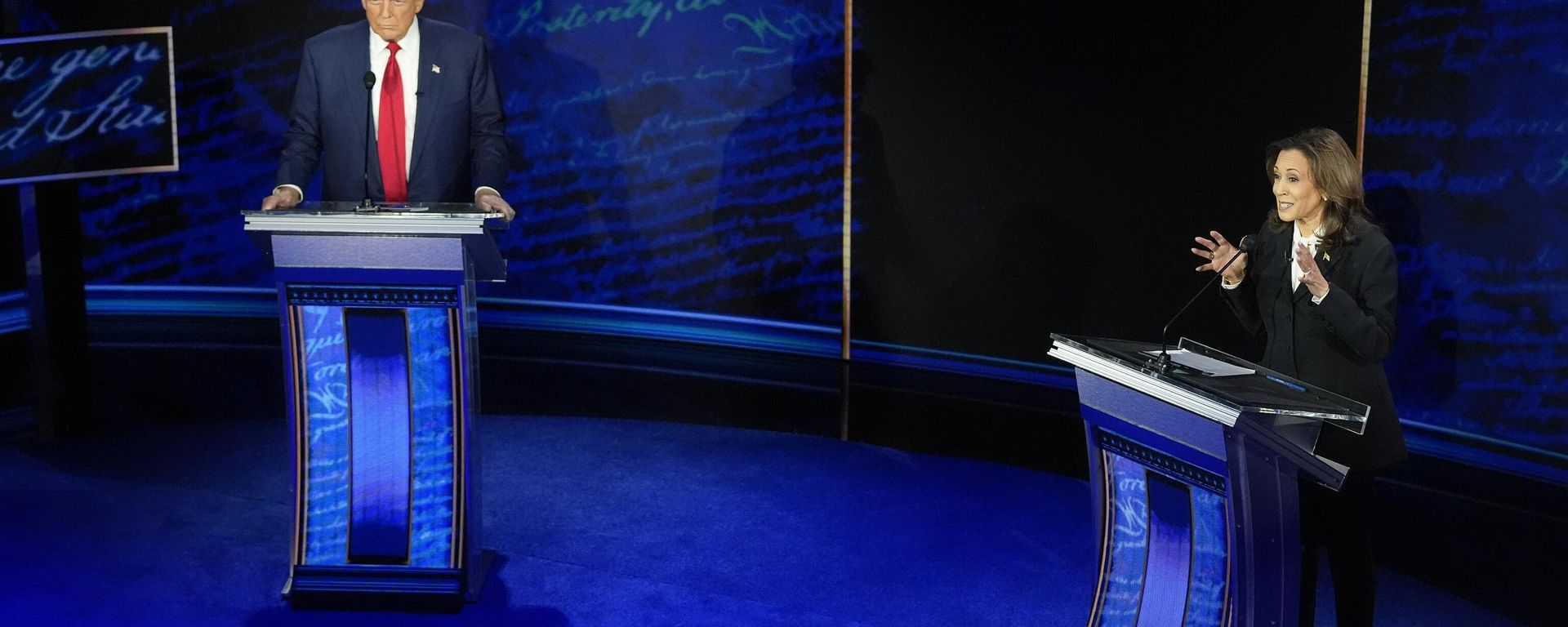 Republican presidential nominee former President Donald Trump watches as Democratic presidential nominee Vice President Kamala Harris speaks during an ABC News presidential debate at the National Constitution Center, Tuesday, Sept. 10, 2024, in Philadelphia. Republican presidential nominee former President Donald Trump watches as Democratic presidential nominee Vice President Kamala Harris speaks during an ABC News presidential debate at the National Constitution Center, Tuesday, Sept. 10, 2024, in Philadelphia. - Sputnik International, 1920, 30.10.2024