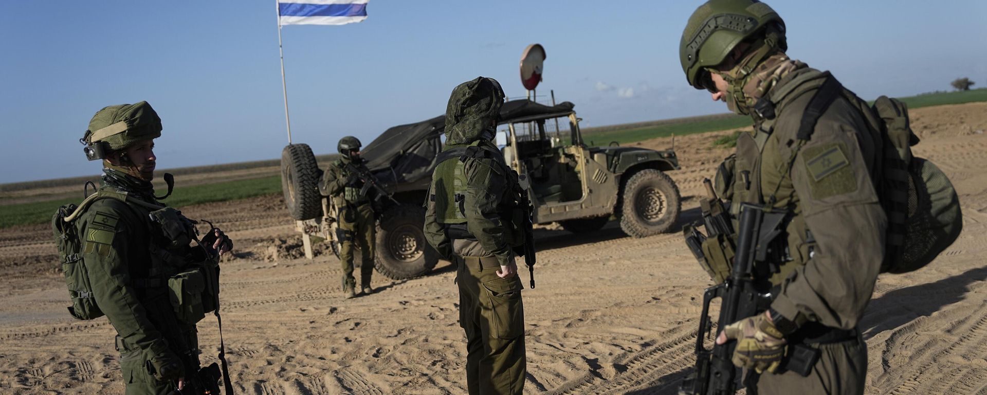 Israeli soldiers are seen near the Gaza Strip border in southern Israel, Monday, March 4, 2024 - Sputnik International, 1920, 27.06.2026