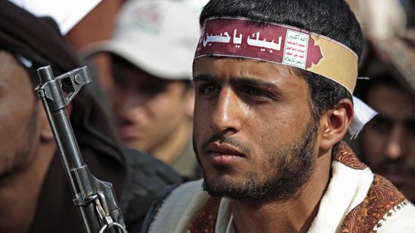 A supporter of Yemen's Shiite Houthi rebels, wears a bandana with with an Arabic inscription that reads, at your service [Imam] Hussein, as he attends festivities marking the holy day of Ashoura, in Sanaa, Yemen, Thursday, Aug. 19, 2021. - Sputnik International