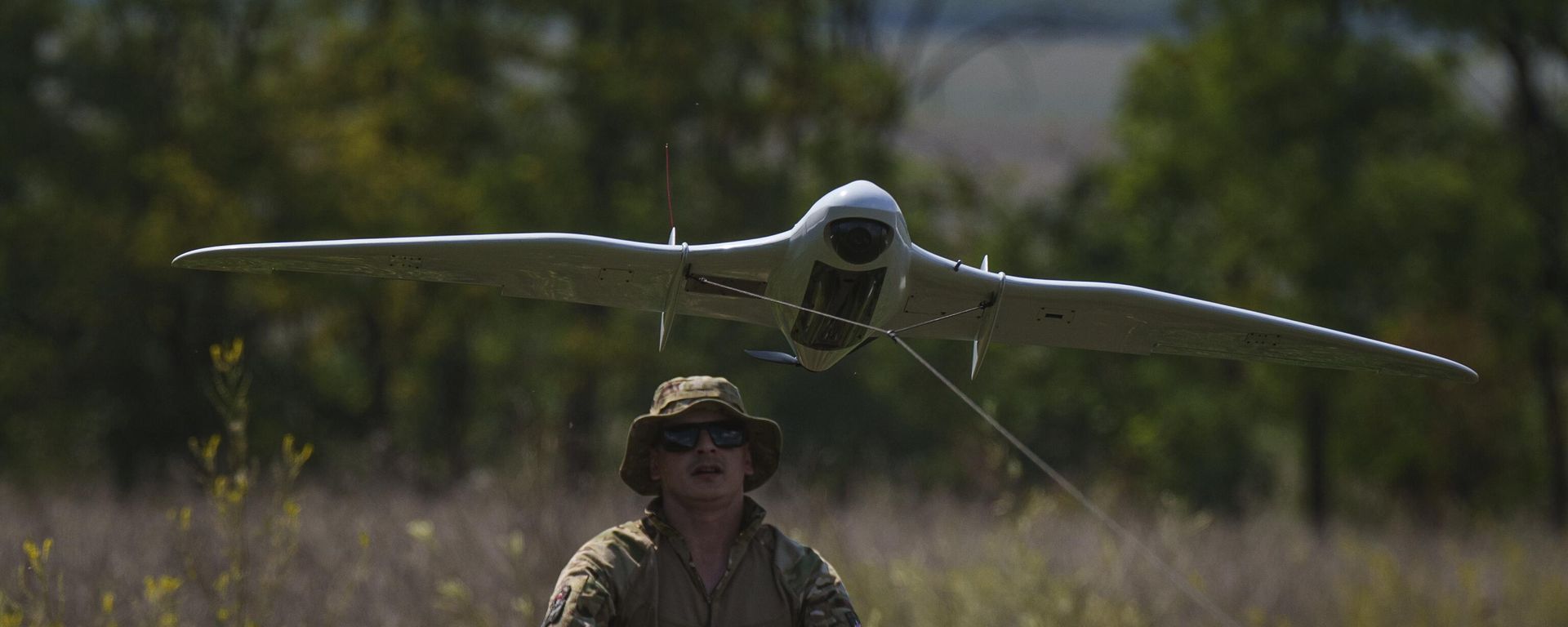 A Ukrainian serviceman of the Ochi reconnaissance unit launches a Furia drone to fly over Russian positions at the frontline in Donetsk region, Ukraine, on Sunday, June 30, 2024.  - Sputnik International, 1920, 27.09.2025