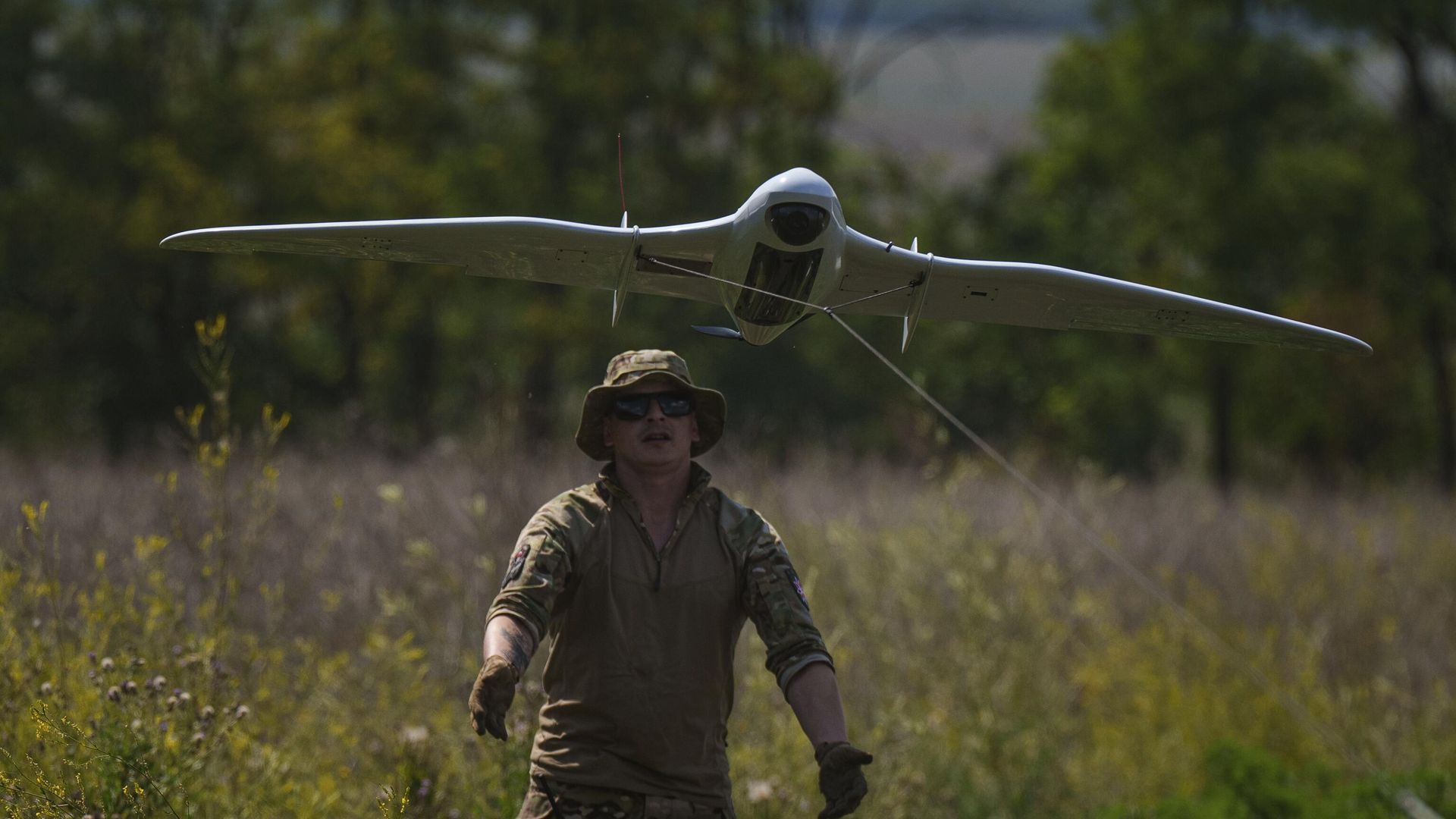 A Ukrainian serviceman of the Ochi reconnaissance unit launches a Furia drone to fly over Russian positions at the frontline in Donetsk region, Ukraine, on Sunday, June 30, 2024.  - Sputnik International, 1920, 23.10.2024