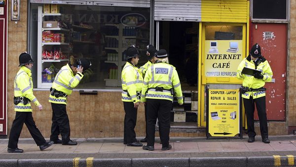 Police officers gather outside a property in the Cheetham Hill area of Manchester, England, Thursday, April 9, 2009 - Sputnik International