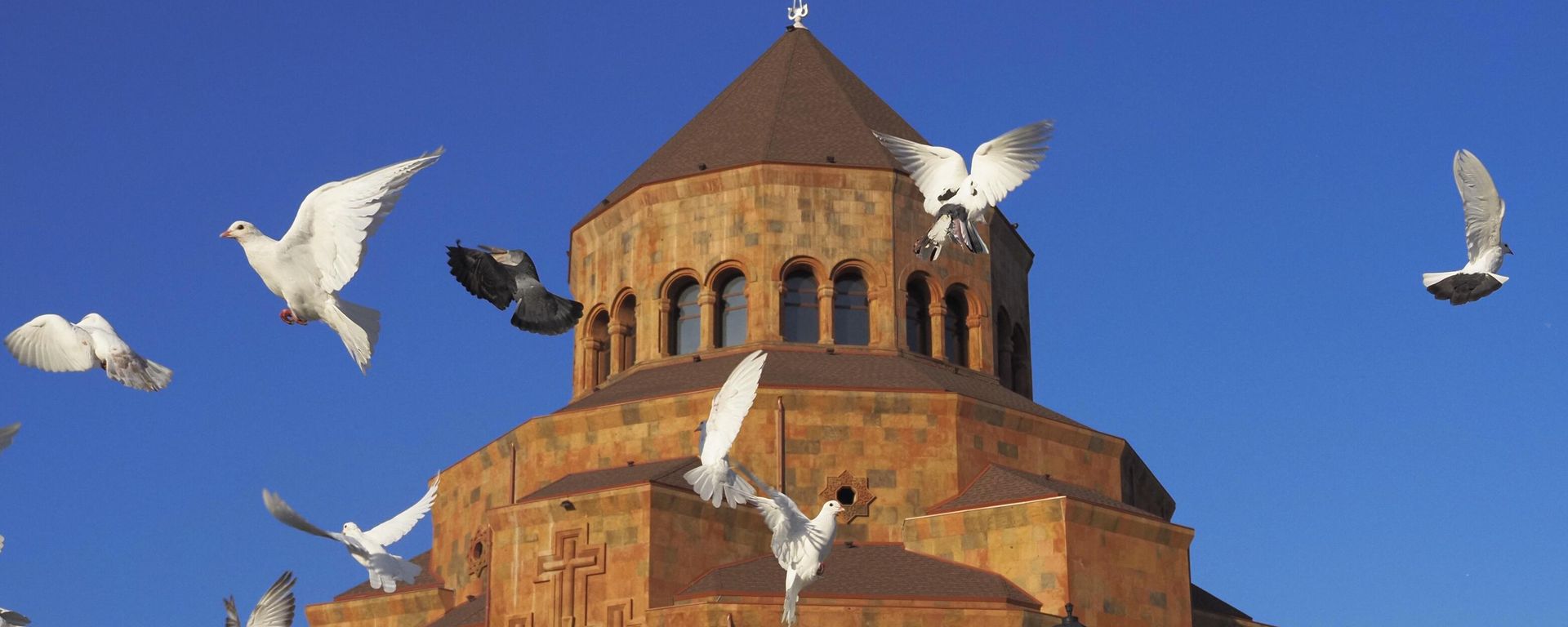 Pigeons fly near Holy Mother of God Cathedral in Stepanakert, in the separatist region of Nagorno-Karabakh, Friday, Oct. 30, 2020 - Sputnik International, 1920, 10.07.2025