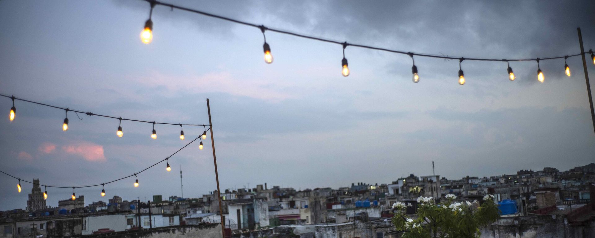Customers sit on a terrace at La Guarida restaurant in Havana, Cuba, Wednesday, Nov. 3, 2021 - Sputnik International, 1920, 19.02.2026
