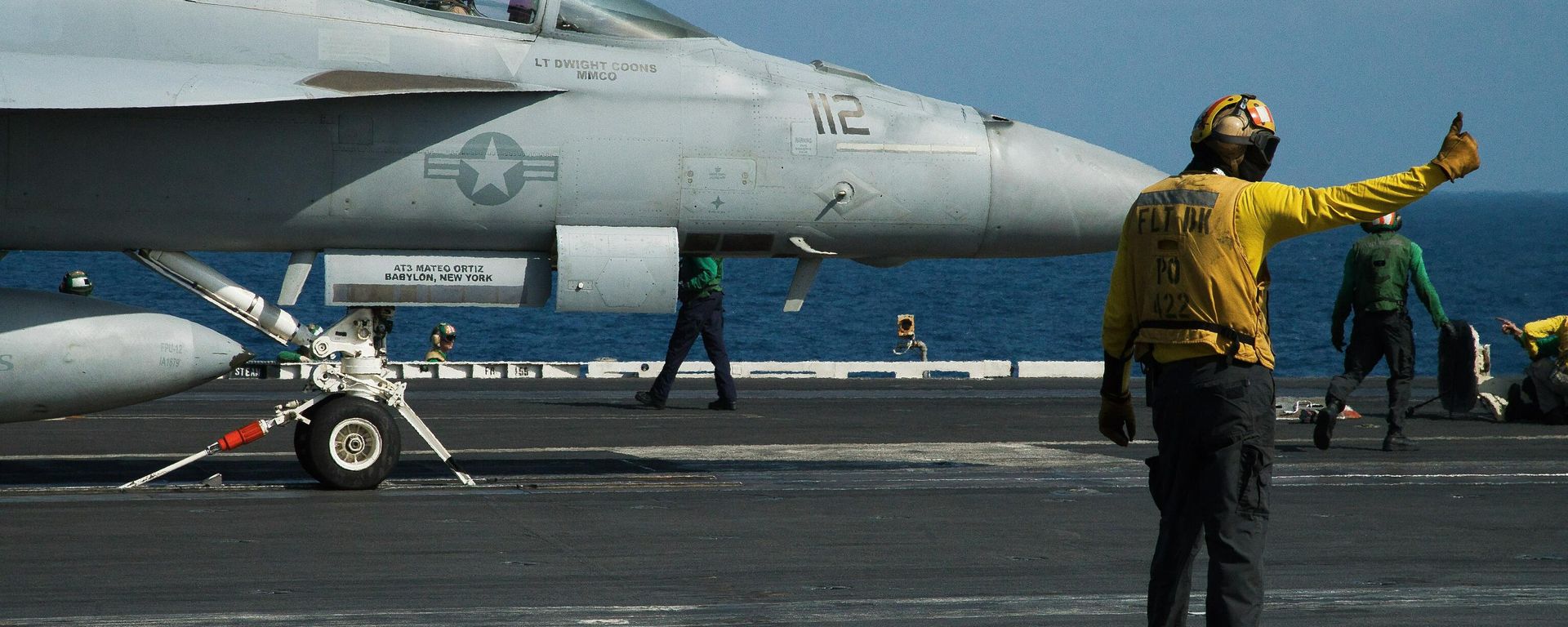 A crew member signals as a pilot prepares to launch an F/A-18 fighter jet on the deck of the USS Abraham Lincoln aircraft carrier in the Arabian Sea. 2019 file photo. The Lincoln is currently deployed in the Red Sea to assist in the US-led Operation Prosperity Guardian campaign against Yemen's Houthi militia - who have enforced a partial blockade of the Red Sea to Israeli-linked and allied merchant shipping. A crew member signals as a pilot prepares to launch an F/A-18 fighter jet on the deck of the USS Abraham Lincoln aircraft carrier in the Arabian Sea. 2019 file photo. The Lincoln is currently deployed in the Red Sea to assist in the US-led Operation Prosperity Guardian campaign against Yemen's Houthi militia - who have enforced a partial blockade of the Red Sea to Israeli-linked and allied merchant shipping. - Sputnik International, 1920, 31.10.2024