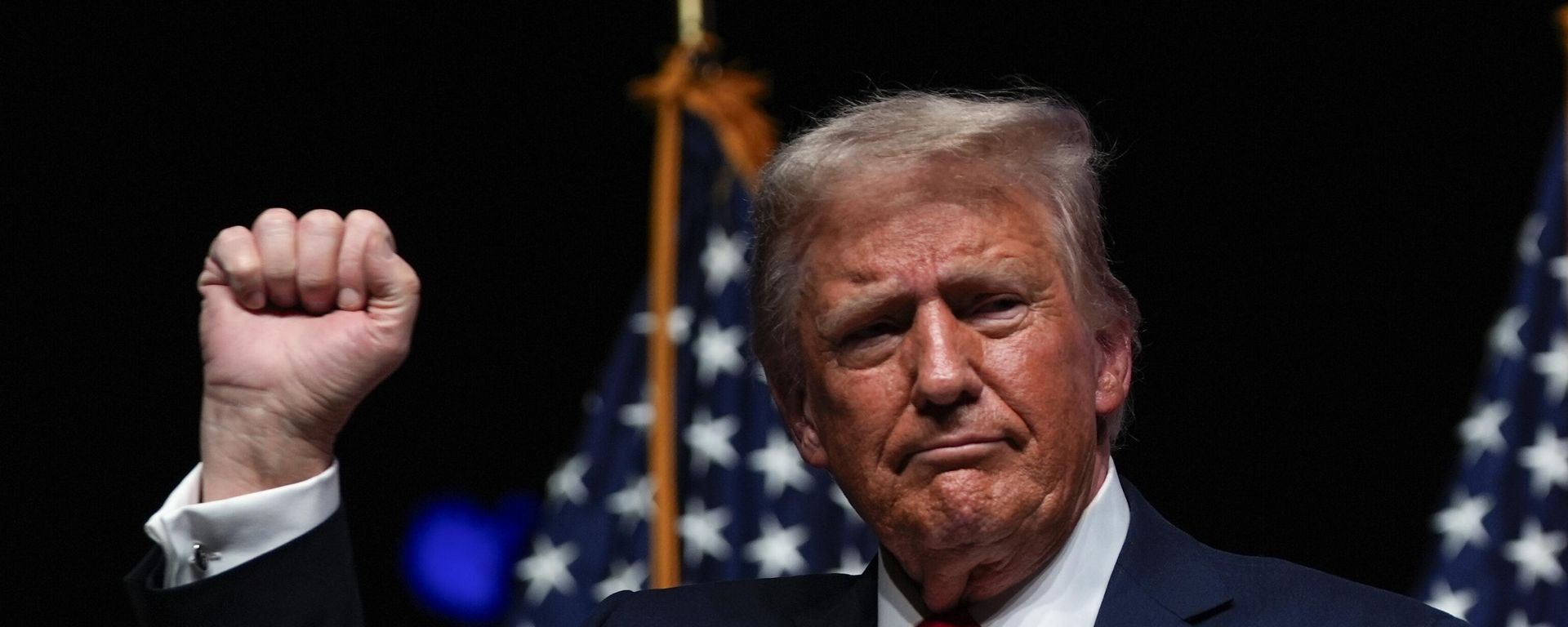 Republican presidential nominee former President Donald Trump gestures after a Tucker Carlson Live Tour show at Desert Diamond Arena, Thursday, Oct. 31, 2024, in Glendale, Ariz. Republican presidential nominee former President Donald Trump gestures after a Tucker Carlson Live Tour show at Desert Diamond Arena, Thursday, Oct. 31, 2024, in Glendale, Ariz. - Sputnik International, 1920, 17.02.2025