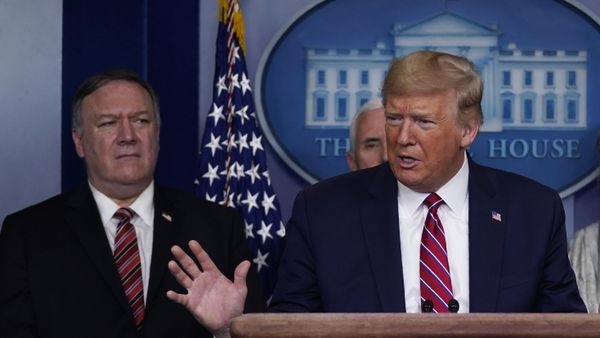 In this March 20, 2020, file photo, with then-Secretary of State Mike Pompeo to the rear, then-US President Donald Trump speaks during a coronavirus task force briefing at the White House in Washington. In this March 20, 2020, file photo, with then-Secretary of State Mike Pompeo to the rear, then-US President Donald Trump speaks during a coronavirus task force briefing at the White House in Washington. - Sputnik International