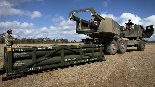 The process of preparing a crane for loading the Army Tactical Missile System (ATACMS) on to the High Mobility Artillery Rocket System (HIMARS). File photo - Sputnik International