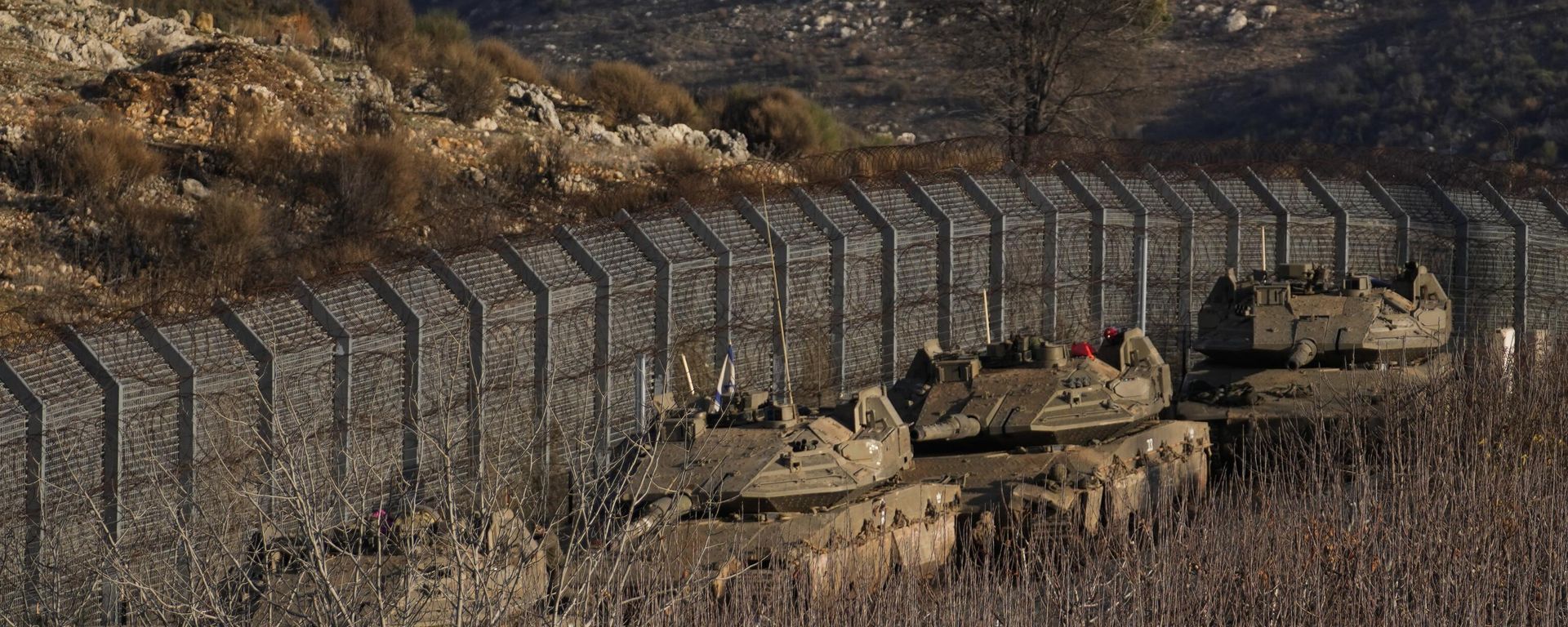 Israeli armored vehicles park along the so-called Alpha Line that separates the Israeli-annexed Golan Heights from Syria, Sunday, Dec. 8, 2024.  - Sputnik International, 1920, 21.12.2024