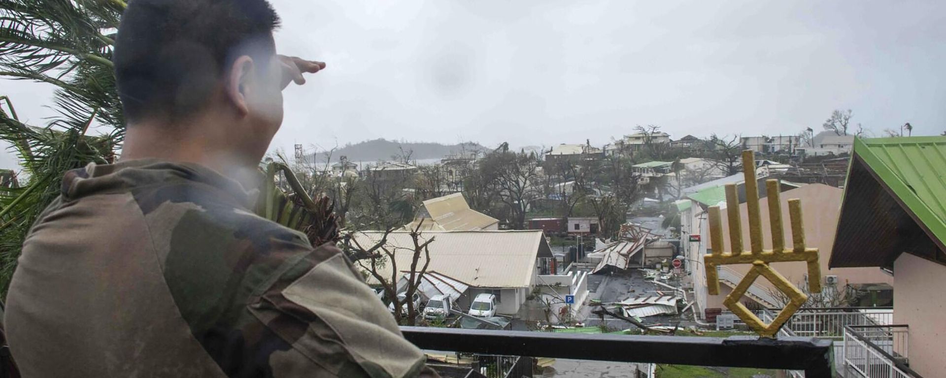 This photo provided by the French Army shows a soldier looking at damages in the French territory of Mayotte in the Indian Ocean, after Cyclone Chido caused extensive damage with reports of several fatalities. This photo provided by the French Army shows a soldier looking at damages in the French territory of Mayotte in the Indian Ocean, after Cyclone Chido caused extensive damage with reports of several fatalities. - Sputnik International, 1920, 16.12.2024