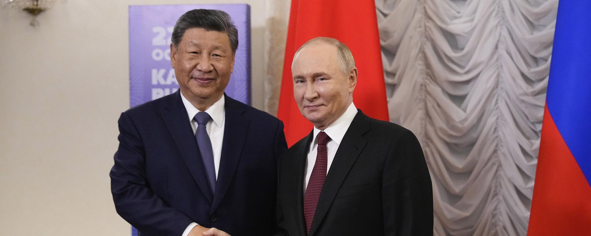 Russian President Vladimir Putin, right, and Chinese President Xi Jinping shake hands during their meeting on the sidelines of BRICS Summit at Kazan Kremlin in Kazan, Russia, Tuesday, Oct. 22, 2024. - Sputnik International, 1920, 11.05.2026