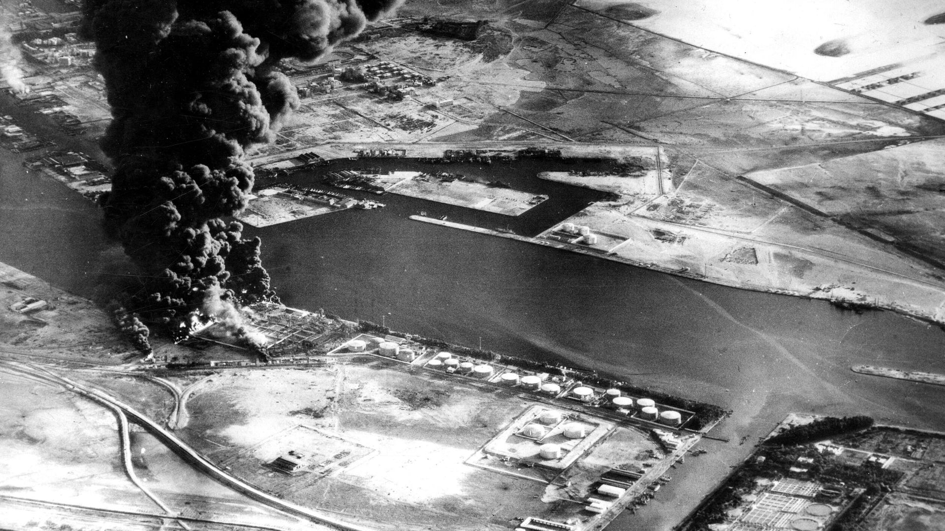 In this Nov. 11, 1956 file photo, fuel installations on the Suez Canal burn after an attack by aircraft of the Sea Venom Squadron from HMS Eagle as Britain, France and Israel intervened militarily and occupied the canal zone following Egypt nationalizing the canal.  - Sputnik International, 1920, 01.01.2025