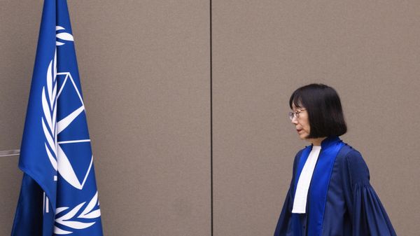 Judge Tomoko Akane walks before delivering the verdict in the Al Hassan case at the International Criminal Court in The Hague, Netherlands, Wednesday Nov. 20, 2024. - Sputnik International