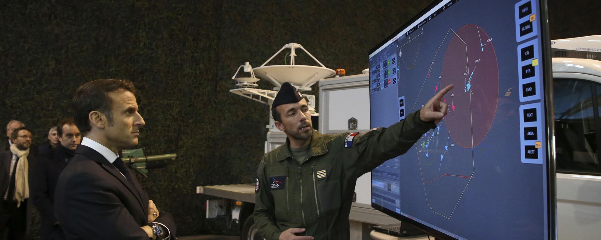 French President Emmanuel Macron, left, listens to explanations as he visits the Mont-de-Marsan air base. File photo. - Sputnik International, 1920, 24.03.2025