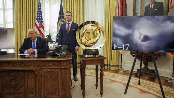 President Donald Trump, left, and Secretary of Defense Pete Hegseth listen as an image of an F-47 sixth-generation fighter jet is displayed during an event in the Oval Office of the White House in Washington, Friday, March 21, 2025.  - Sputnik International