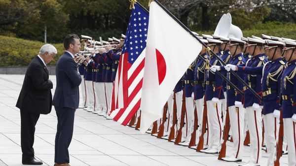 Japan's Defense Minister Gen Nakatani, left, and US Defense Secretary Pete Hegseth review an honor guard during a welcome ceremony at the Ministry of Defense in Tokyo Sunday, March 30, 2025. - Sputnik International
