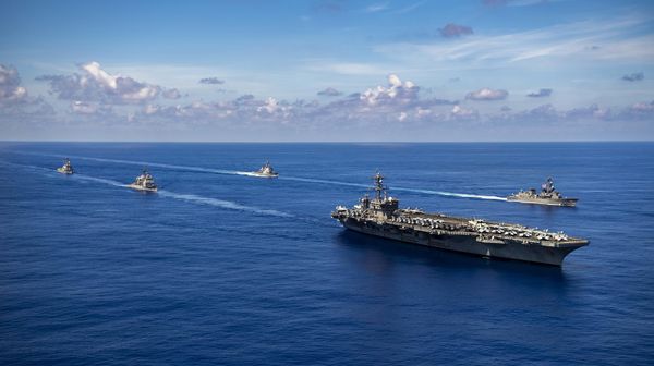 USS Carl Vinson and missile destroyer escorts sail with Japanese warships. File photo. - Sputnik International