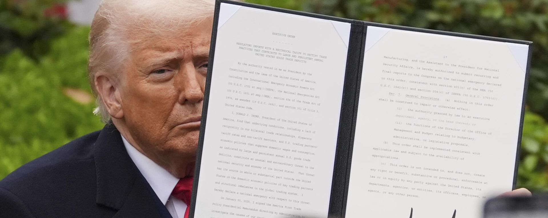 President Donald Trump holds a signed executive order during an event to announce new tariffs in the Rose Garden of the White House, Wednesday, April 2, 2025, in Washington - Sputnik International, 1920, 03.04.2025