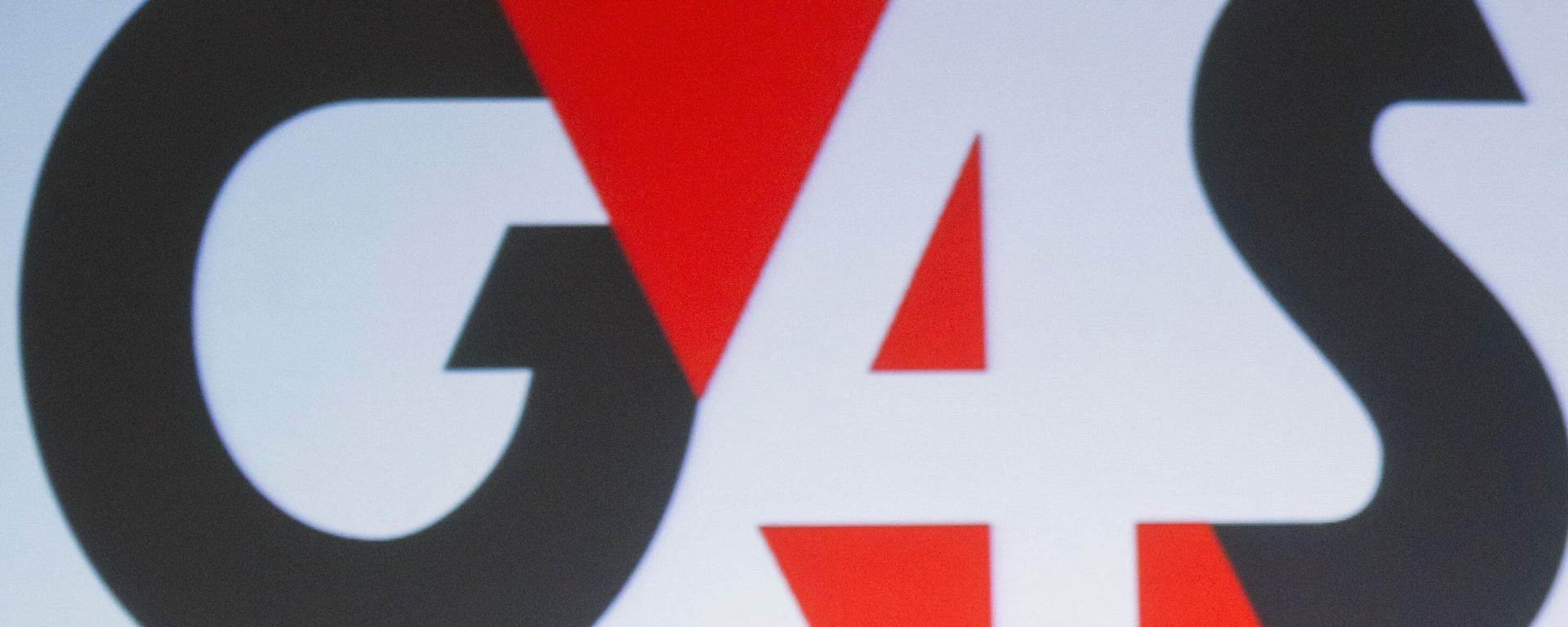 FILE - In this file photo dated Thursday, Jan. 26, 2012 a G4S security company logo is seen during a news conference in London.  The board of Norway's sovereign wealth fund said Thursday Nov. 14, 2019, it is banning all financial holdings in British security services company G4S due to the risk that it “contributes to or is responsible for serious or systematic human rights violations.” following a recommendation from Norway’s Council on Ethics, which monitors investments. - Sputnik International, 1920, 07.04.2025
