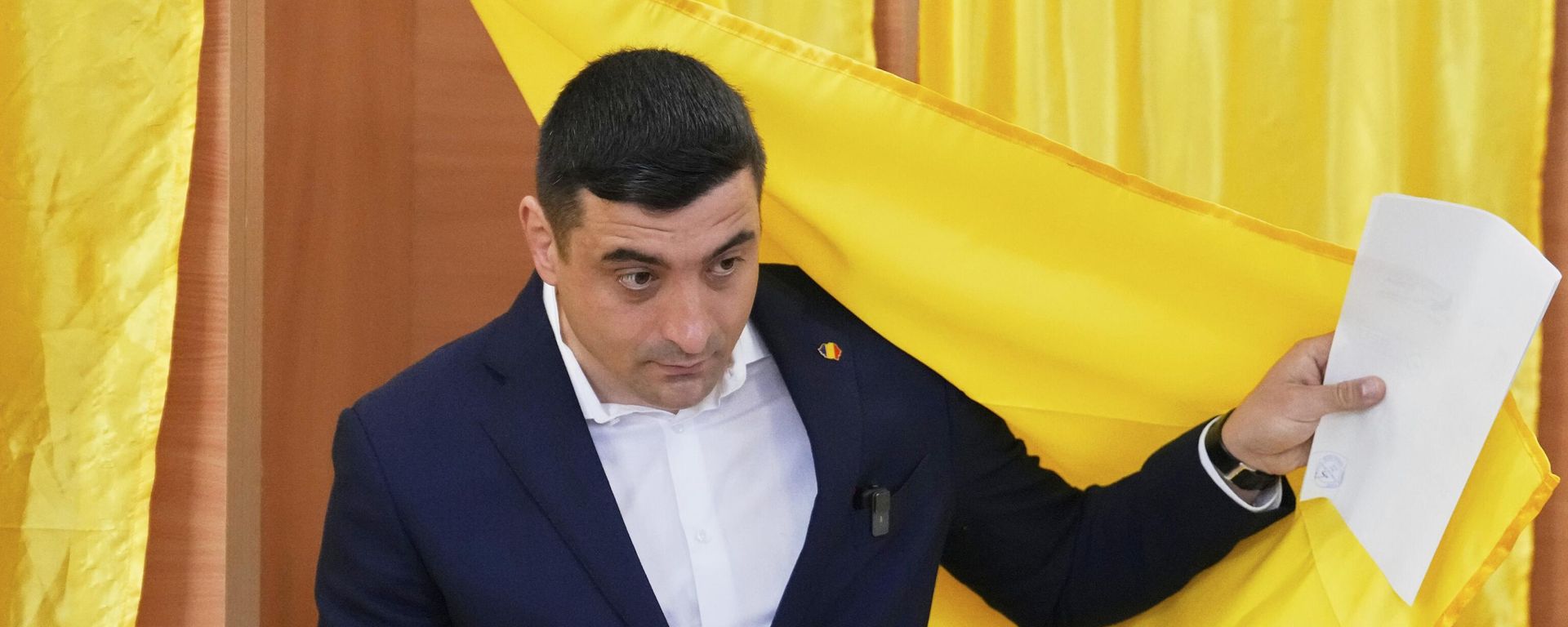 Presidential candidate George Simion exits a voting cabin before casting his vote in the first round of the presidential election redo in Mogosoaia, Romania, Sunday, May 4, 2025.  - Sputnik International, 1920, 05.05.2025