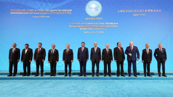 July 4, 2024. Russian President Vladimir Putin at a joint photo session of the heads of delegations of the member states of the Shanghai Cooperation Organization (SCO). - Sputnik International