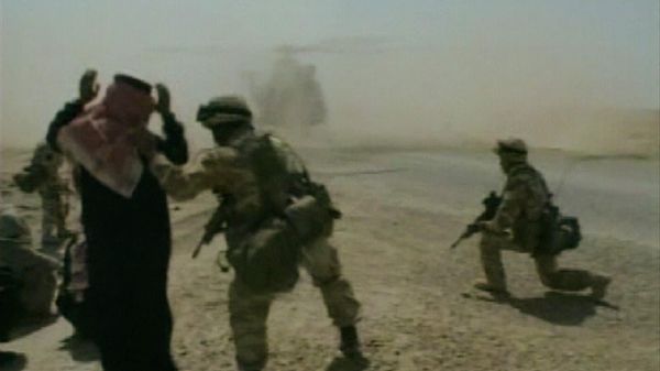 In this image taken from video, a British soldier directs an Iraqi to kneel, while an RAF Puma helicopter lands, Thursday, April 3, 2003, during patrols around Nasiriyah, Iraq.  - Sputnik International