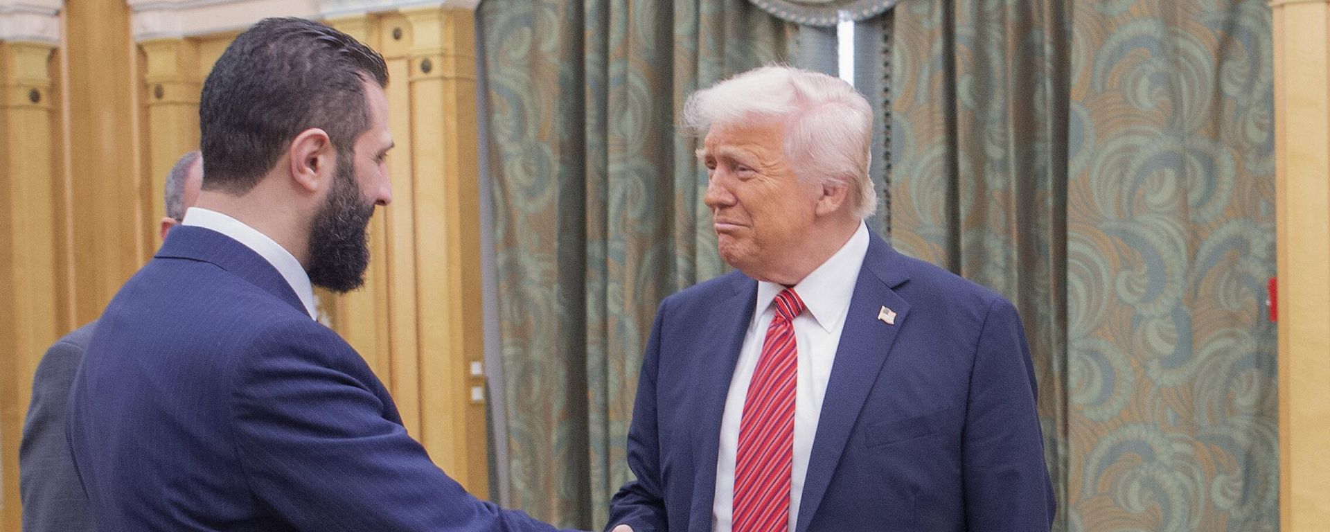 In this photo released by the Saudi Royal Palace, President Donald Trump, right, shakes hands with Syria's interim President Ahmad al-Sharaa, in Riyadh, Saudi Arabia, Wednesday, May 14, 2025 In this photo released by the Saudi Royal Palace, President Donald Trump, right, shakes hands with Syria's interim President Ahmad al-Sharaa, in Riyadh, Saudi Arabia, Wednesday, May 14, 2025 - Sputnik International, 1920, 14.12.2025