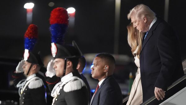 President Donald Trump and first lady Melania Trump arrive at Leonardo da Vinci International Airport to attend the funeral of Pope Francis, Friday, April 25, 2025, in Rome. - Sputnik International