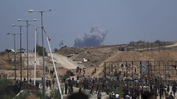 Smoke rises following an Israeli bombardment in southern Gaza, as seen from a humanitarian aid distribution center operated by the US-backed Gaza Humanitarian Foundation, approved by Israel, in Khan Younis, southern Gaza Strip, on Thursday, May 29, 2025. Smoke rises following an Israeli bombardment in southern Gaza, as seen from a humanitarian aid distribution center operated by the US-backed Gaza Humanitarian Foundation, approved by Israel, in Khan Younis, southern Gaza Strip, on Thursday, May 29, 2025. - Sputnik International