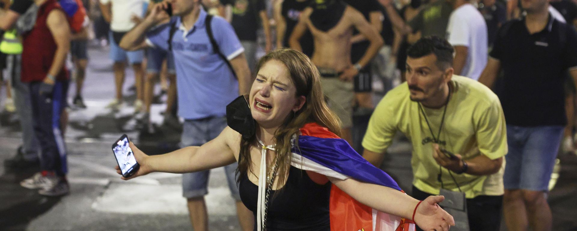 People react at the end of a rally pressing for an early election after nearly eight months of almost daily anti-corruption demonstrations that have shaken the government of President in Belgrade, Serbia, Saturday, June 28, 2025 People react at the end of a rally pressing for an early election after nearly eight months of almost daily anti-corruption demonstrations that have shaken the government of President in Belgrade, Serbia, Saturday, June 28, 2025 - Sputnik International, 1920, 30.06.2025