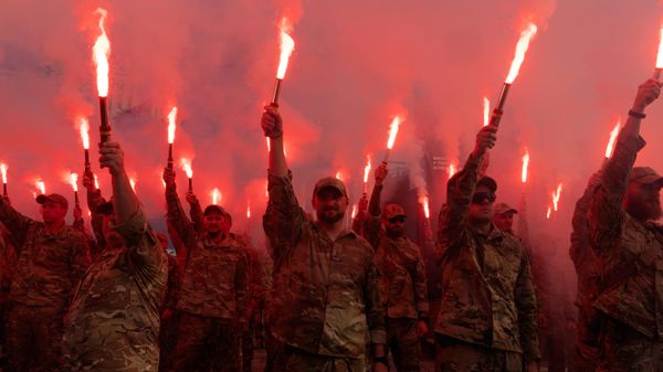 FILE - Soldiers of Ukraine's Azov battalion light flares at a rally demanding the release of prisoners of war at Independence Square in Kiev, Ukraine, Sunday, July 28, 2024. - Sputnik International