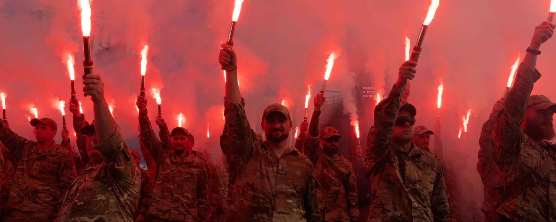 FILE - Soldiers of Ukraine's Azov battalion light flares at a rally demanding the release of prisoners of war at Independence Square in Kiev, Ukraine, Sunday, July 28, 2024. - Sputnik International, 1920, 06.07.2025