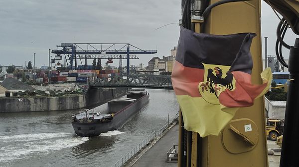 A German flag is fixed at a construction vehicle in the small harbor in Frankfurt, Germany, Wednesday, May 7, 2025.  - Sputnik International