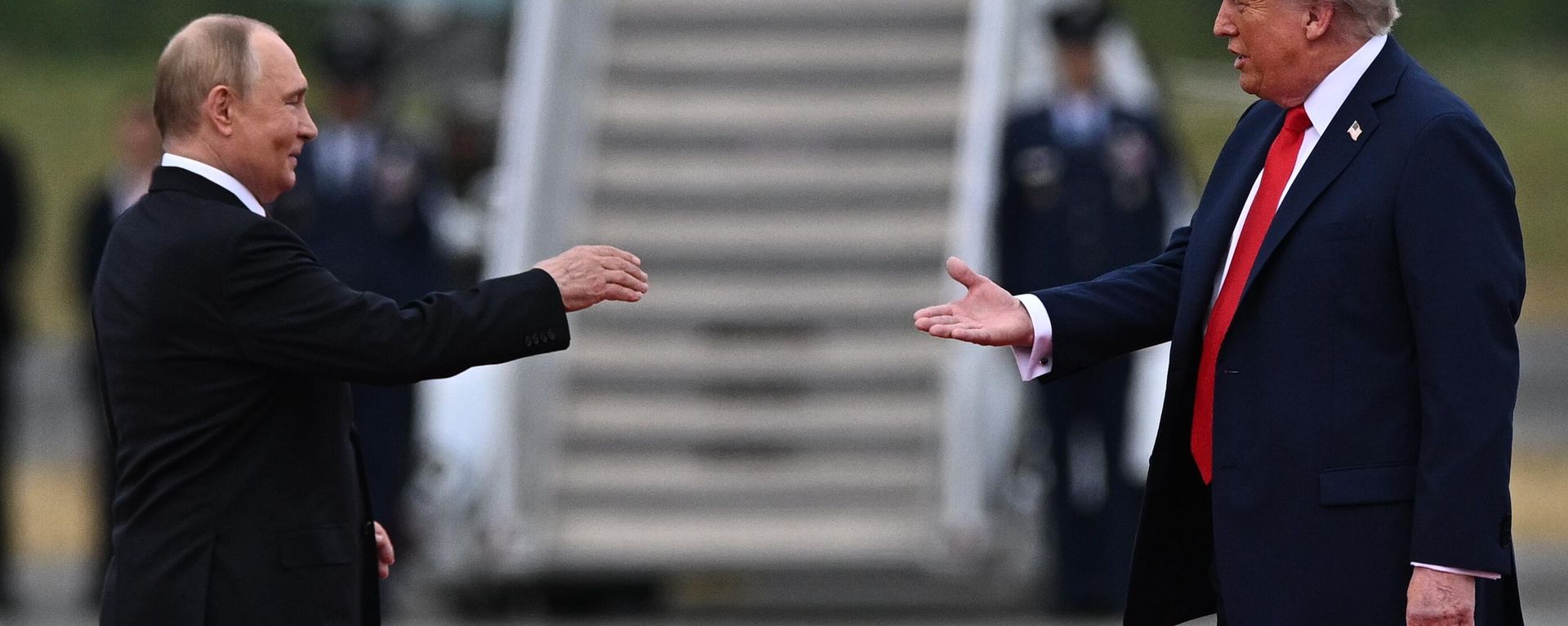 US President Donald Trump greets Russian President Vladimir Putin on the tarmac after they arrived to attend a meeting at Joint Base Elmendorf-Richardson in Anchorage, Alaska, the United States. - Sputnik International, 1920, 02.02.2026