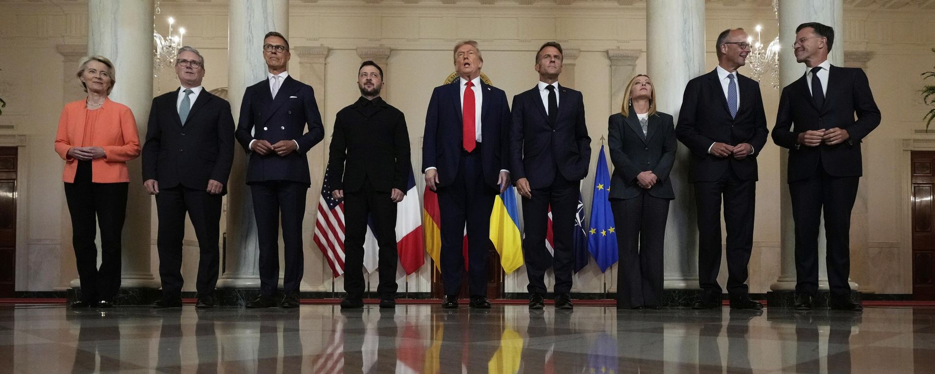 European Commission President Ursula von der Leyen, from left, British Prime Minister Keir Starmer, Finland's President Alexander Stubb, Ukraine's Volodymyr Zelensky, President Donald Trump, France's President Emmanuel Macron, Italy's Prime Minister Giorgia Meloni, Germany's Chancellor Friedrich Merz and NATO Secretary General Mark Rutte pose for a group photo in the Grand Foyer of the White House, Monday, Aug. 18, 2025, in Washington. European Commission President Ursula von der Leyen, from left, British Prime Minister Keir Starmer, Finland's President Alexander Stubb, Ukraine's Volodymyr Zelensky, President Donald Trump, France's President Emmanuel Macron, Italy's Prime Minister Giorgia Meloni, Germany's Chancellor Friedrich Merz and NATO Secretary General Mark Rutte pose for a group photo in the Grand Foyer of the White House, Monday, Aug. 18, 2025, in Washington. - Sputnik International, 1920, 10.12.2025