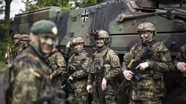 Soldiers of the German forces, Bundeswehr, stand in front of a Boxer military vehicle, a new type of armoured personnel carrier, at the Julius Leber Barracks in Berlin, Germany, Wednesday, April 24, 2024.  - Sputnik International