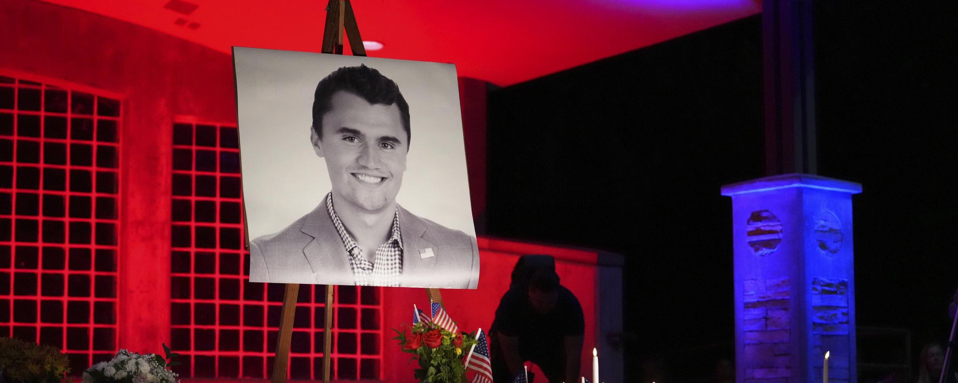 A photo of Charlie Kirk, the CEO and co-founder of Turning Point USA who was shot and killed, stands at his vigil A photo of Charlie Kirk, the CEO and co-founder of Turning Point USA who was shot and killed, stands at his vigil - Sputnik International, 1920, 12.09.2025