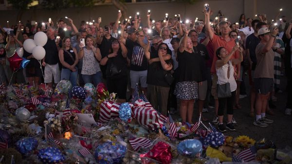 People visit a makeshift memorial for Charlie Kirk outside Turning Point USA headquarters  - Sputnik International