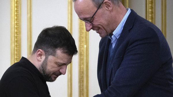 Volodymyr Zelenskyy, left, and the Chairman of the German Christian Democratic Party (CDU) Friedrich Merz shake hands during their meeting in Kyiv, Ukraine, Monday, Dec. 9, 2024.  - Sputnik International