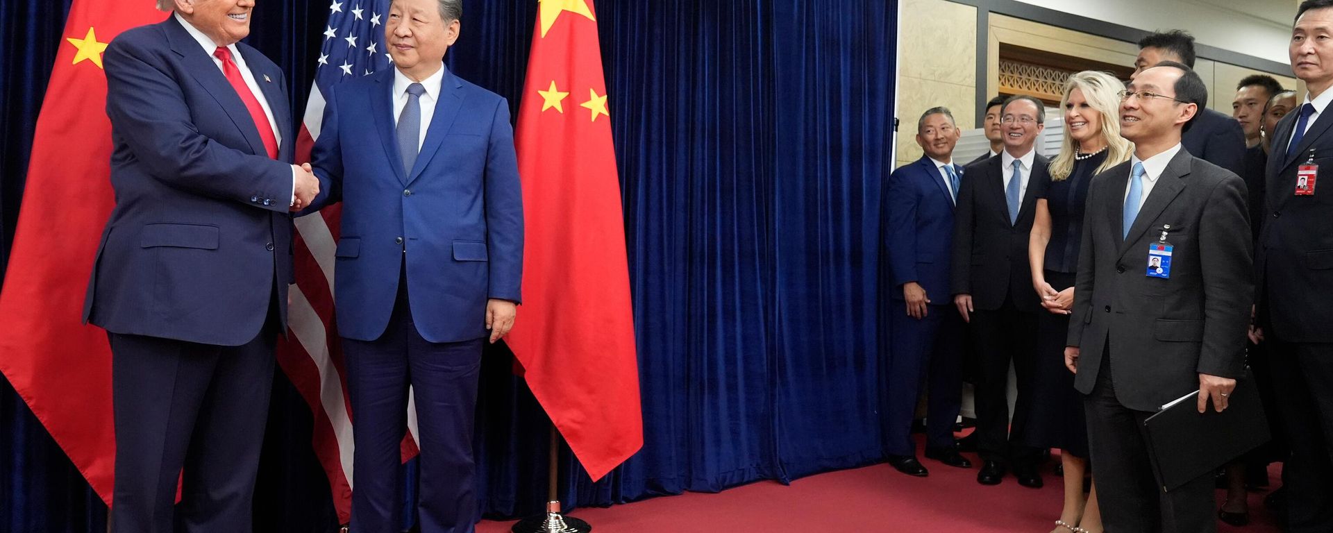 President Donald Trump, left, and Chinese President Xi Jinping shake hands before their meeting at Gimhae International Airport in Busan, South Korea, Thursday, Oct. 30, 2025.  - Sputnik International, 1920, 13.03.2026