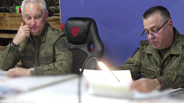 Russian Defense Minister Andrei Belousov (left) listens to a report from the commander of the Yug Battlegroup, Colonel General Alexander Sanchik. - Sputnik International