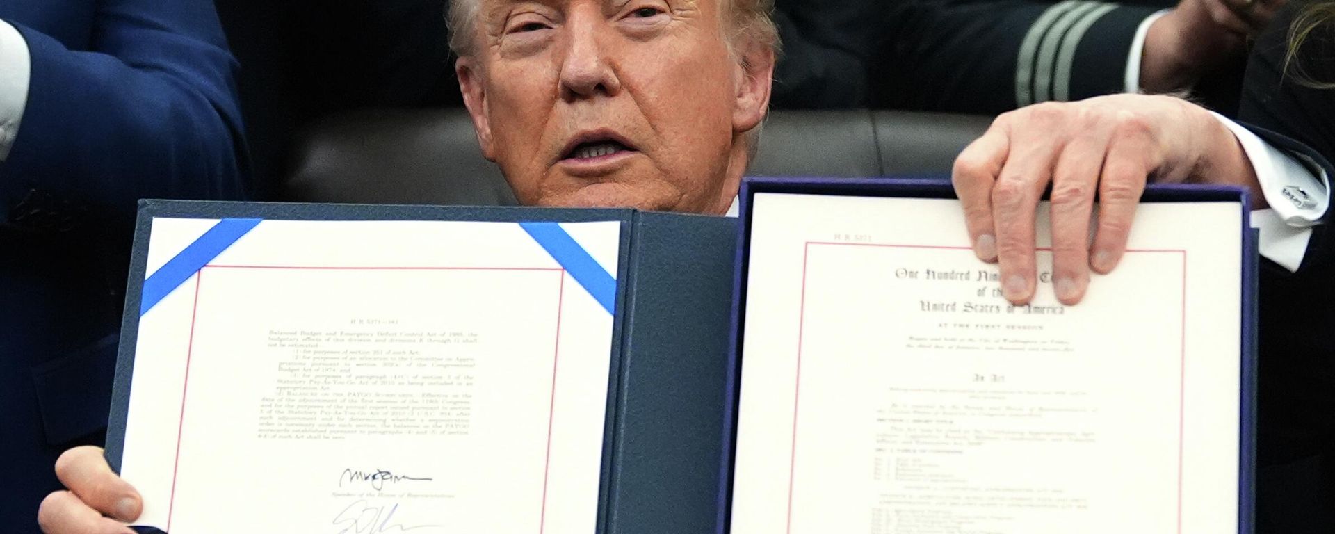 President Donald Trump displays the signed the funding bill to reopen the government, in the Oval Office of the White House, Wednesday, Nov. 12, 2025, in Washington.  - Sputnik International, 1920, 13.11.2025