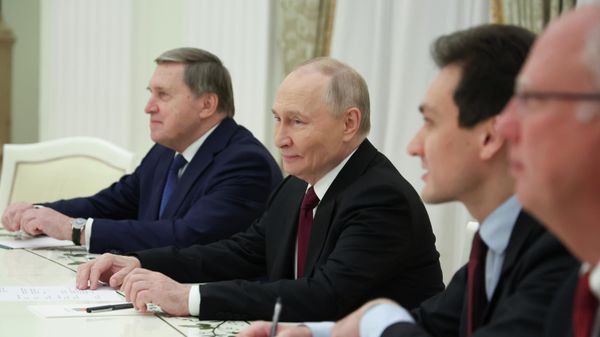 Russian President Vladimir Putin, center, Russian Presidential foreign policy adviser Yuri Ushakov, left, and Russian Direct Investment Fund CEO Special Presidential Representative for Investment and Economic Cooperation with Foreign Countries Kirill Dmitriev, right, attend the talks with U.S. special envoy Steve Witkoff and Jared Kushner, U.S. President Donald Trump's son-in-law, at the Senate Palace of the Kremlin in Moscow, Russia, Tuesday, Dec. 2, 2025. (Alexander Kazakov, Sputnik, Kremlin Pool Photo via AP) - Sputnik International