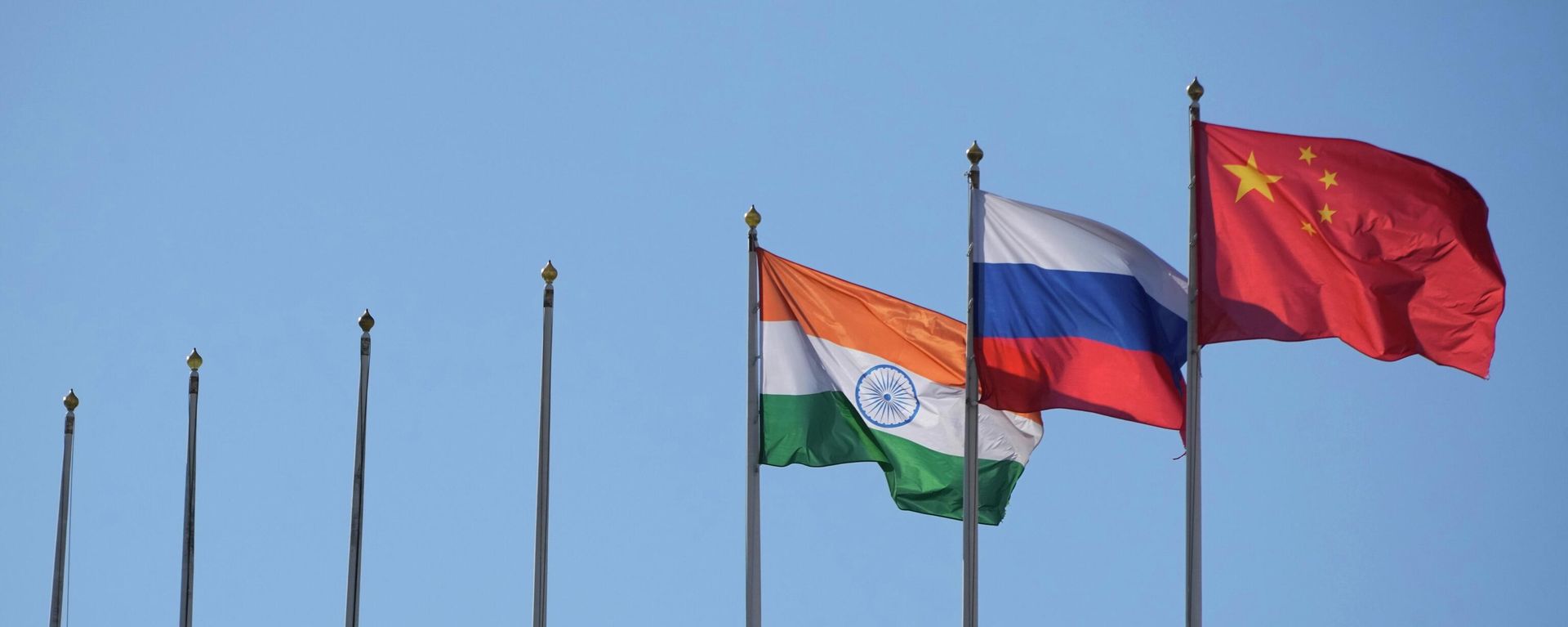The flags of India, Russia and China in St. Petersburg, Russia. File photo - Sputnik International, 1920, 24.12.2025