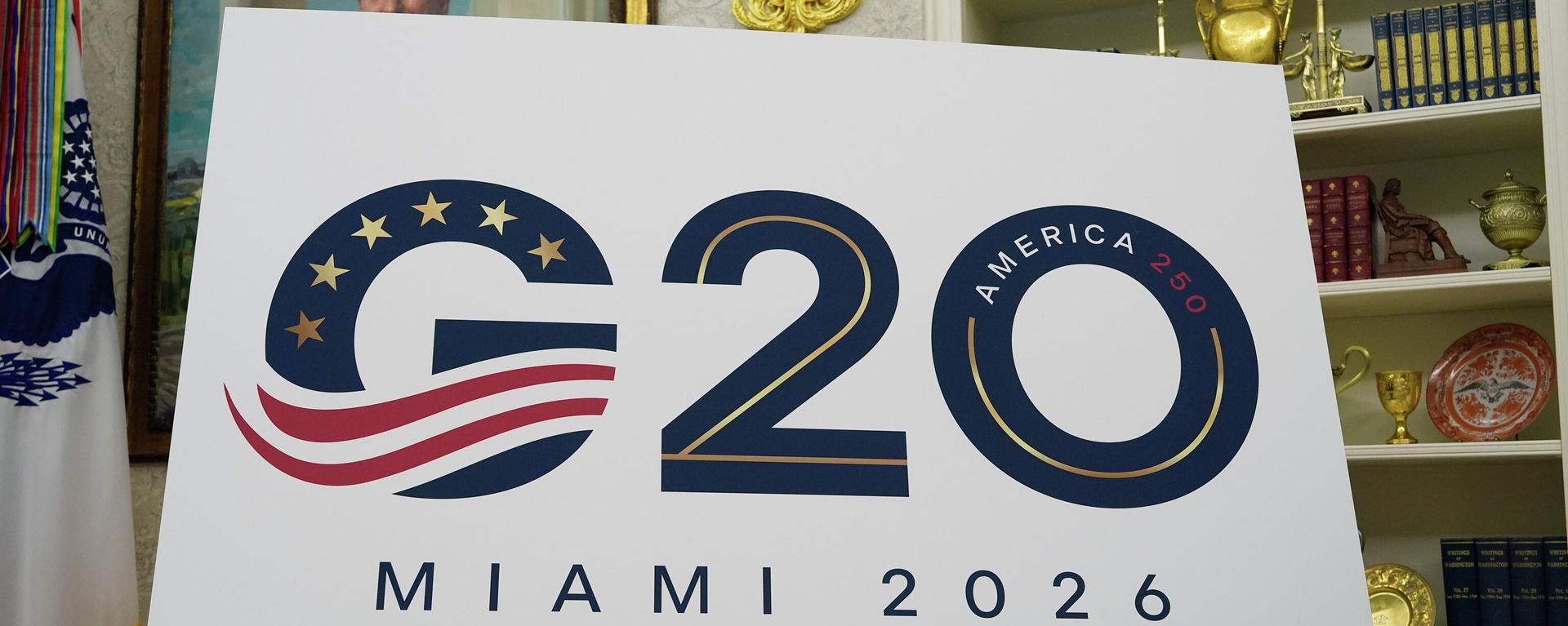 A sign for the G20 to be hosted in Miami in 2026 is displayed as President Donald Trump speaks in the Oval Office of the White House, Friday, Sept. 5, 2025, in Washington. - Sputnik International, 1920, 25.04.2026
