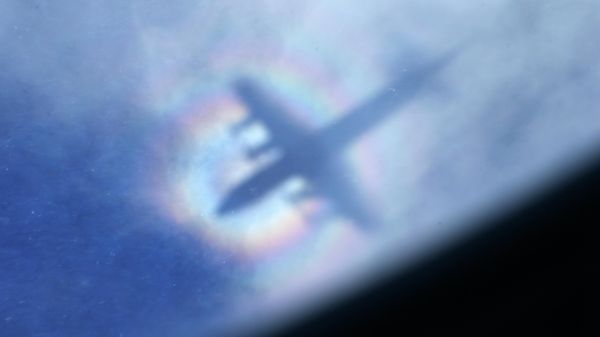 The shadow of a Royal New Zealand Air Force P3 Orion is seen on low level cloud while the aircraft searches for missing Malaysia Airlines Flight MH370 in the southern Indian Ocean, near the coast of Western Australia, March 31, 2014.  - Sputnik International